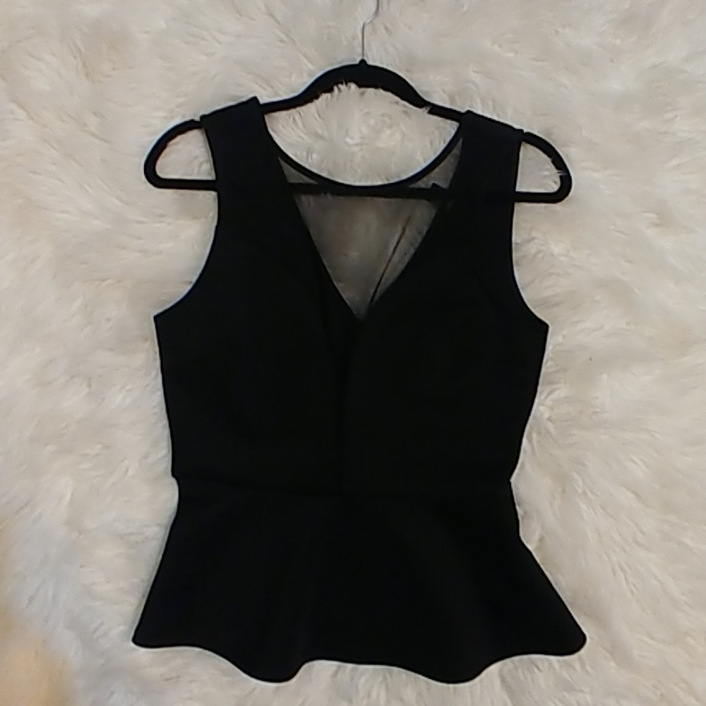 Peplum mesh top.